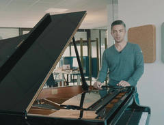 Steinway Spirio | r lover with his concert grand in the office. Steinway Spirio | r lover with his concert grand in the office.