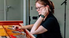 Pianobuilder in the tuning department. Pianobuilder in the tuning department.
